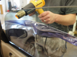 Photo of a window tint removal in progress